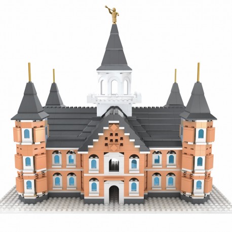 A completed model of the Provo City Center Temple made from building blocks, featuring multiple stories, windows, and a statue on top.